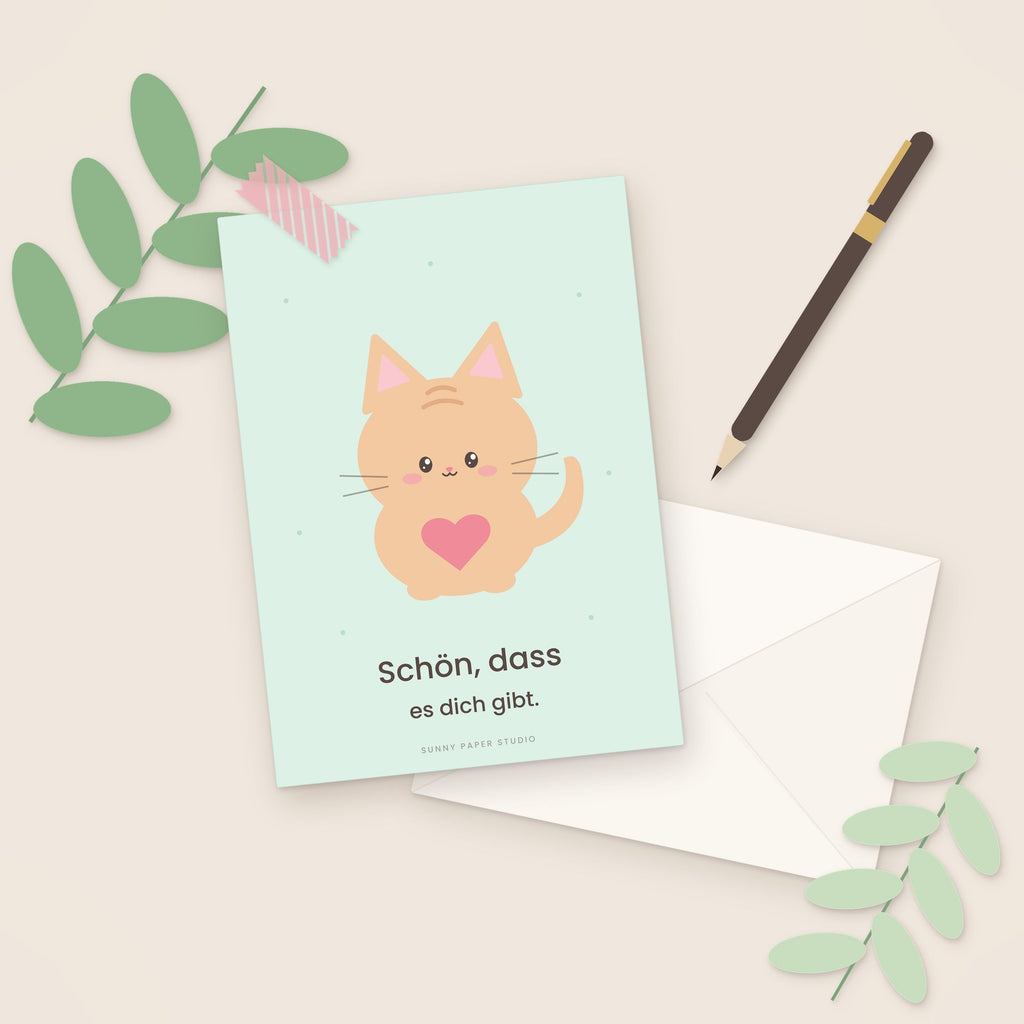 Freundschaftskarte Katze auf dem Schreibtisch mit Stift