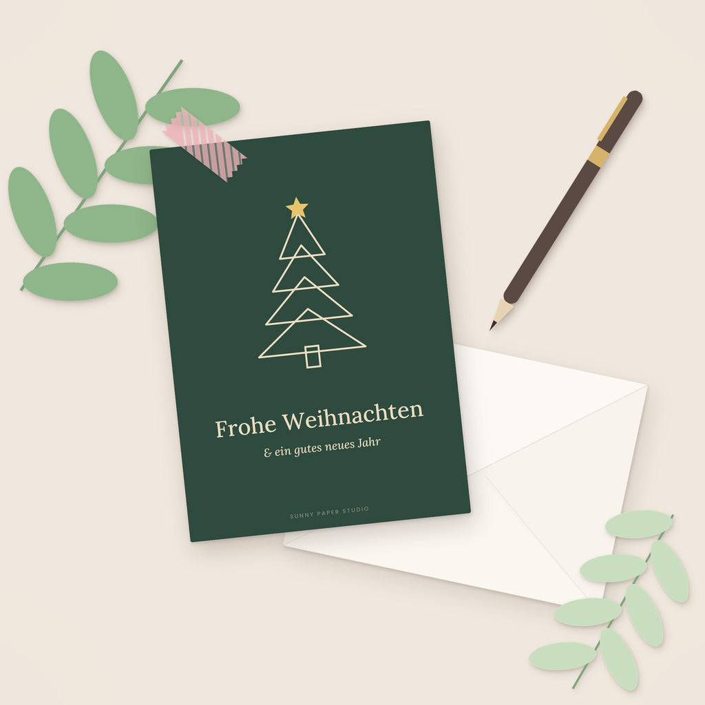 Weihnachtskarte Tannenbaum auf dem Schreibtisch mit Stift