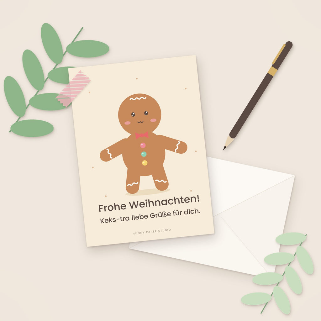 Weihnachtskarte Lebkuchenmann auf dem Schreibtisch mit Stift